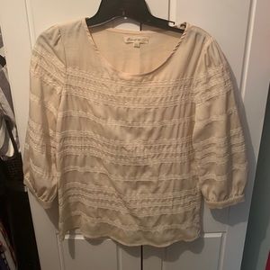 Cream boutique top with embroidery details